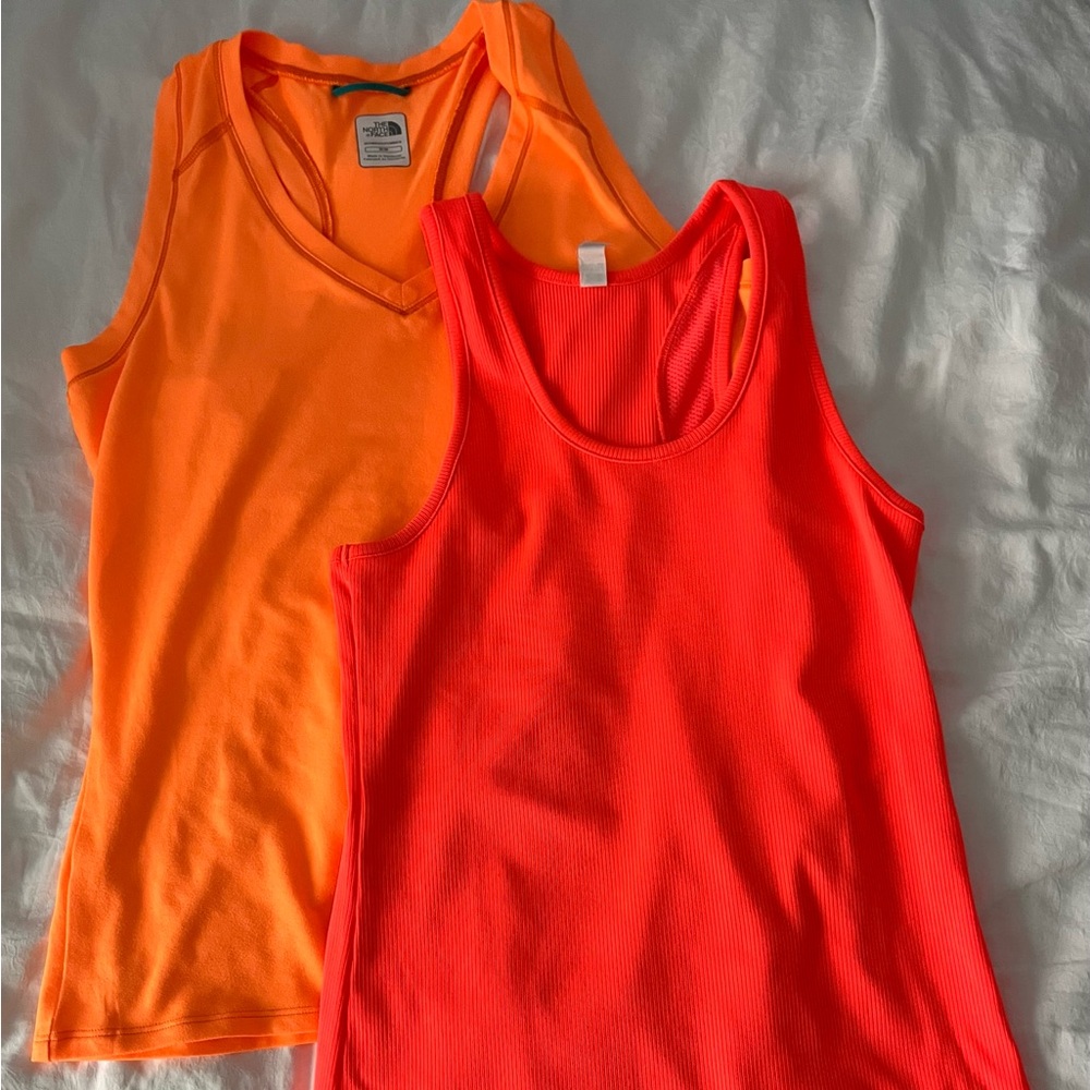 Two orange workout tank tops north face under armor